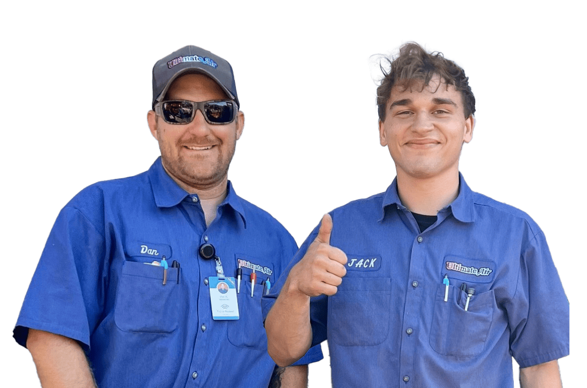 Two Ultimate Air technicians in blue shirts.