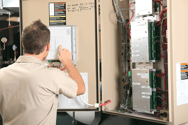 Man looking at furnace